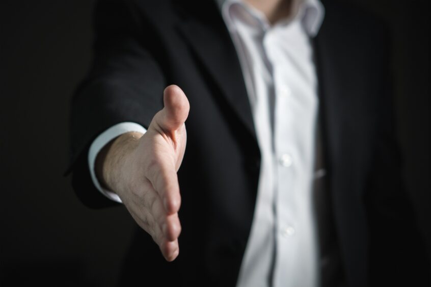 Handshake selling scaled - ponzi schemes - Four Ways to Protect Yourself from Ponzi Schemes | Tamma Capital